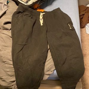 black champion sweatpants with embroider champion logo// size large